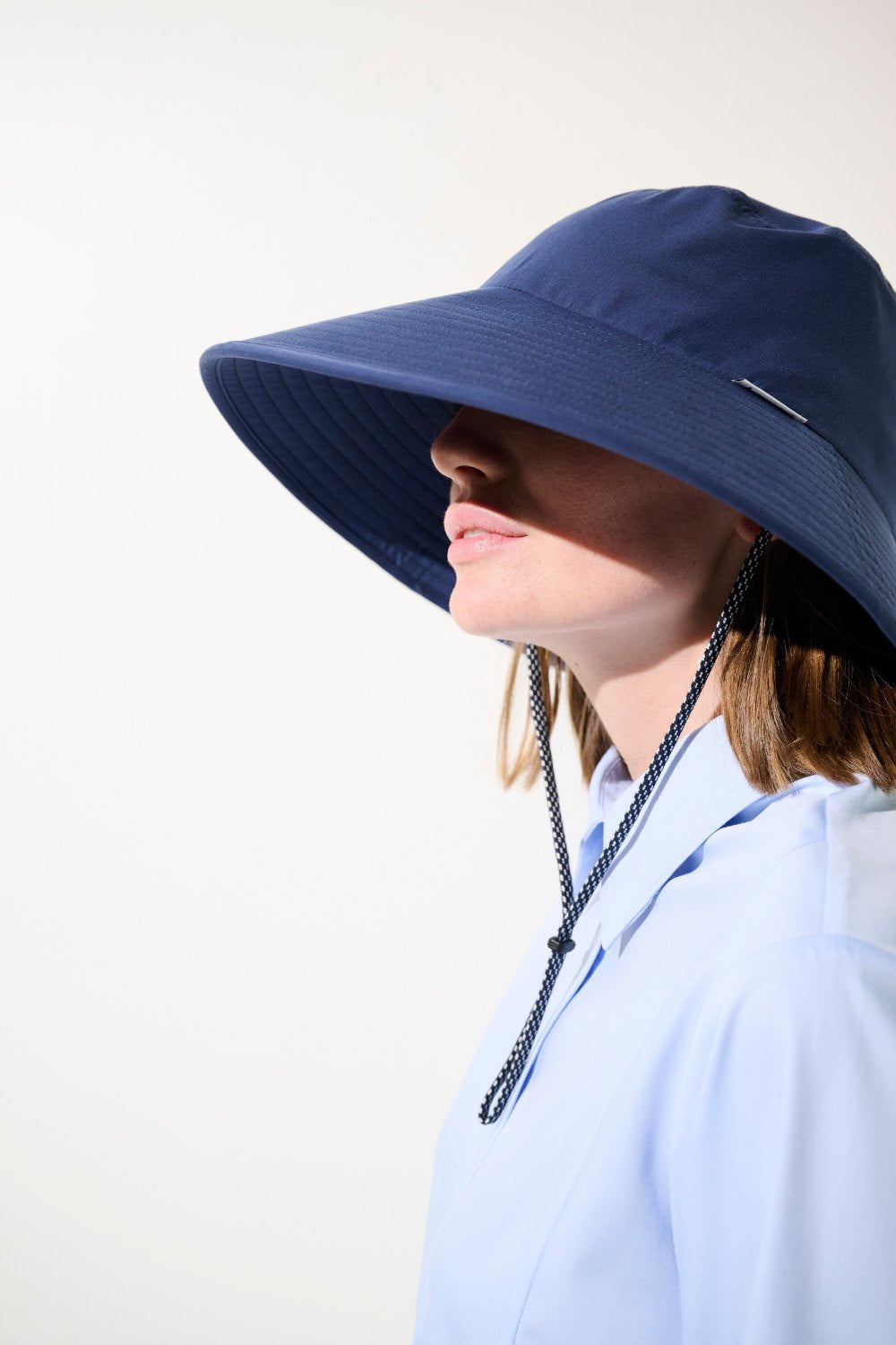 Chapeau anti-UV - Capri bleu marine pour femme, protection solaire UPF 50+ idéal pour activités extérieures.