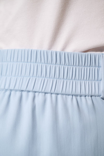 Ceinture élastique bleu du pantalon anti-UV - Faro de Ker Sun, offrant confort et protection solaire UPF 50+.