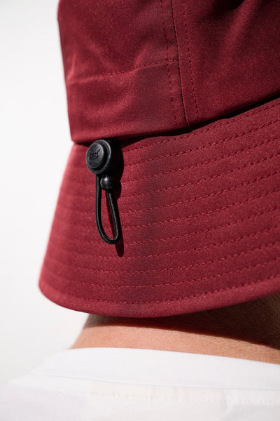 Bob anti-UV - Faro rouge avec cordon de réglage, léger et pratique pour protection solaire efficace.