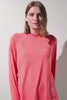 T-shirt anti-UV à capuche - Oasis, femme en rose, UPF 50+, léger et élégant, idéal pour activités sportives.